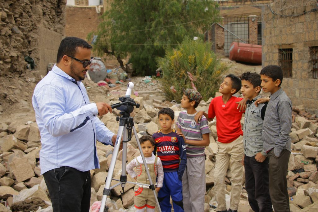  Yemeni journalist Ahmad Algohbary filming 360º video for the documentary “Yemen’s Skies of Terror” Photo courtesy of Al Jazeera Contrast